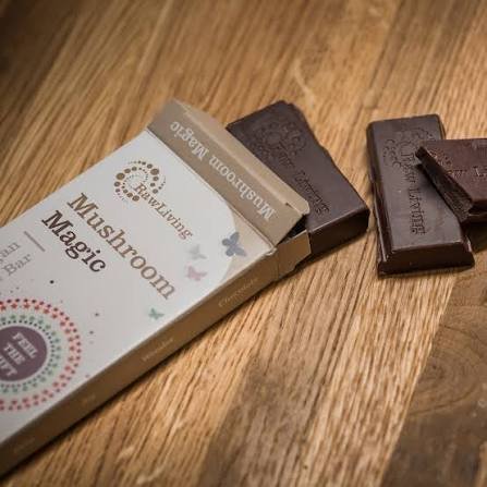Packaged mushroom chocolate bar with premium branding, shown on a white background for product display.